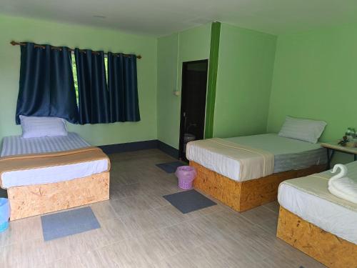 Postel nebo postele na pokoji v ubytování Bussaracum Resort