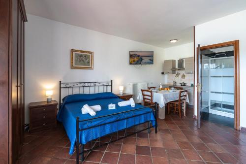 A bed or beds in a room at Tenuta Ricco With Pool And Garden