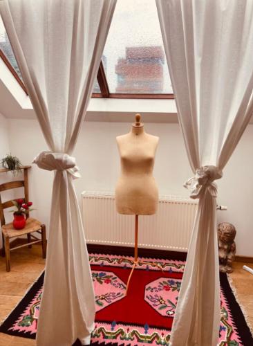 a mannequin in a room with a curtain at Cozy & Spacious Duplex with an Amazing Terrace in Antwerp