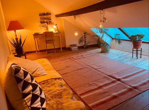 a living room with a large aquarium in the wall at Cozy & Spacious Duplex with an Amazing Terrace in Antwerp