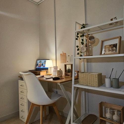 a desk with a chair and a computer on it at Stay Aall Seoul Train Station 2 in Seoul