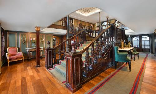 a staircase in a home with wooden floors at Movenpick SS Misr Steamer Nile Cruise - 04 & 07 Nights Each Monday From Luxor and 03 Nights Each Friday from Aswan in Luxor
