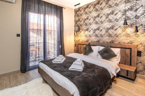 a bedroom with a large bed and a large window at K-Alex Domus in Alexandroupoli in Alexandroupoli