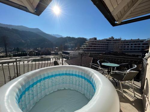 a hot tub on top of a building with a view at Premium Apartment in Fojnica
