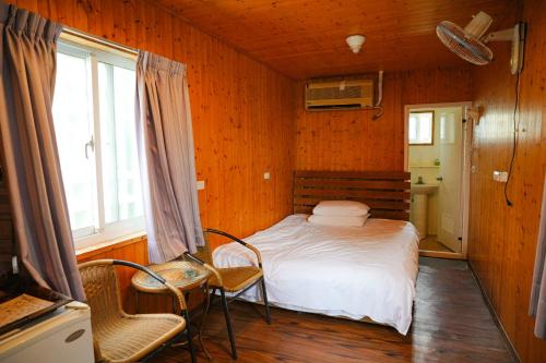 Cama o camas de una habitación en Liu Fu Shan Zhuang
