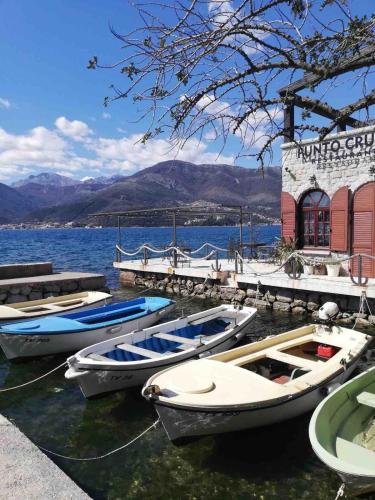 a group of boats are docked in the water at Tivat apartman in Tivat