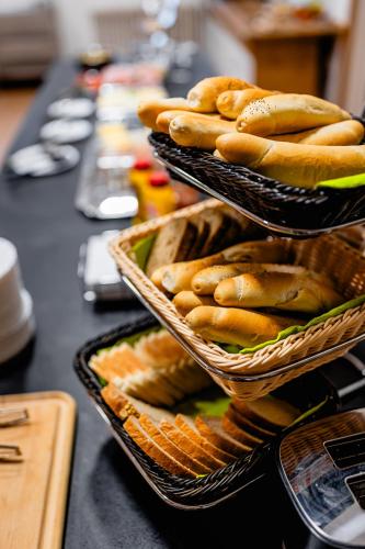 a group of baskets of bread on a table at hotel Dobruška in Dobruška
