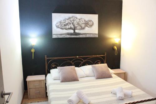 a bedroom with a bed with two towels on it at Sara in Višnjan