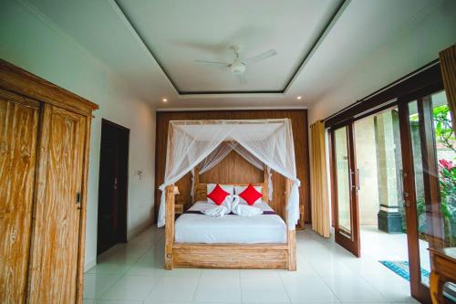 Ένα ή περισσότερα κρεβάτια σε δωμάτιο στο Nia cahya ubud villa