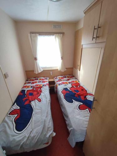 Postel nebo postele na pokoji v ubytování D21 Kirbys Retreat 1, skegness