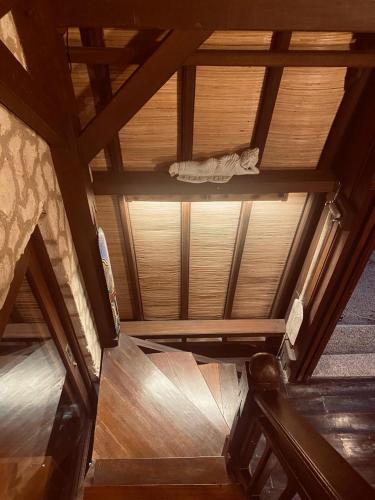 an overhead view of a room with a wooden ceiling at Villa Umbrella Lombok in Senggigi 