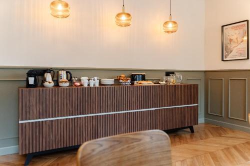 a counter in a room with two pendant lights at Le Falcoz in Saint-Jean-de-Maurienne