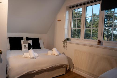 a bedroom with a bed with white towels on it at Luxuria Apartments 2- Bedroom Luxury Apartment in Leicester