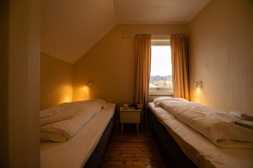 เตียงในห้องที่ Apartment with seaview