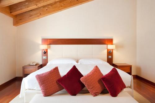 Кровать или кровати в номере Al Tezzon Hotel