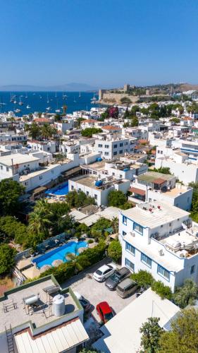 an aerial view of a city with white buildings at Artunc Hotel Bodrum in Bodrum City
