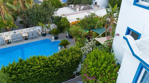 an aerial view of a swimming pool in a resort at Artunc Hotel Bodrum in Bodrum City