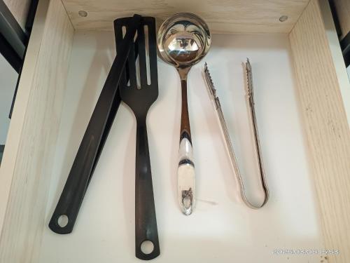 two utensils sitting on top of a table at Cozy Homestay#5 single bed#Batu Kawan Penang in Simpang Ampat