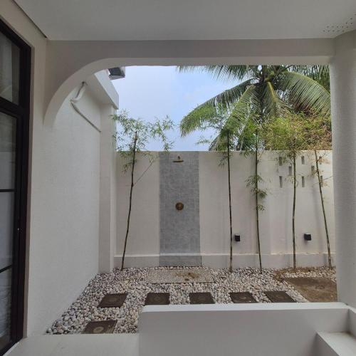 a room with a window with a view of a building at Greek Villa with Pool and Jacuzzi in Davao City