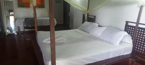 Katil atau katil-katil dalam bilik di Piscine bimoko