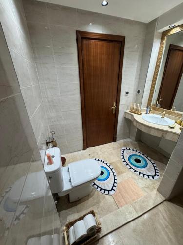 a bathroom with a toilet and a sink at Riad le marin Coucou beach in Agadir