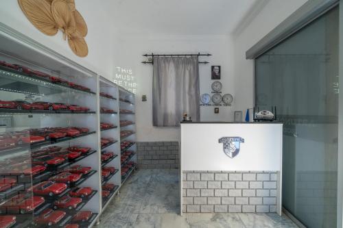 a room filled with lots of red cars on display at Artunc Hotel Bodrum in Bodrum City