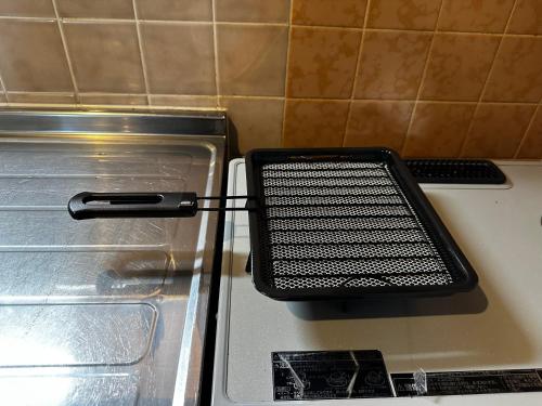 a metal object sitting on top of a stove at AZUR 伊豆熱川 aurora in Higashiizu