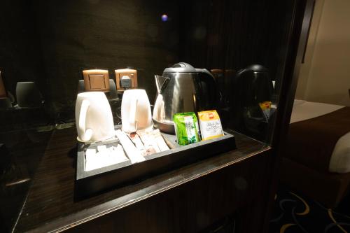 a bathroom counter with two urinals on a table at Bellevue Park Hotel in Taif