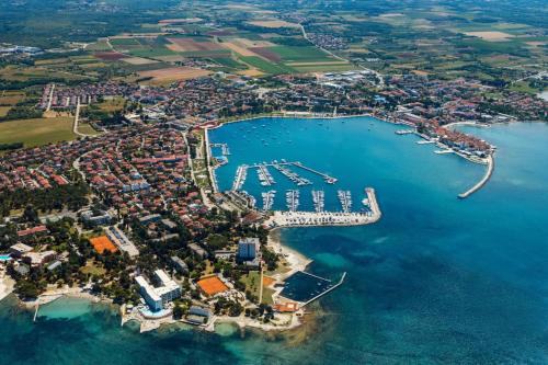 an aerial view of a harbor with boats in the water at Comfortable apartment in Umag with parking space in Murine