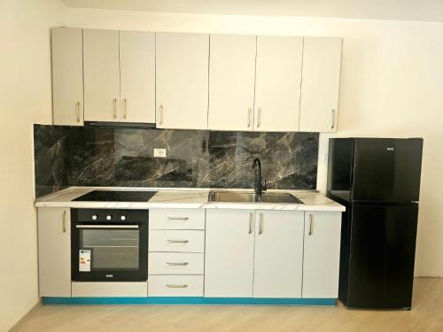 Η κουζίνα ή μικρή κουζίνα στο Dea's Apartments