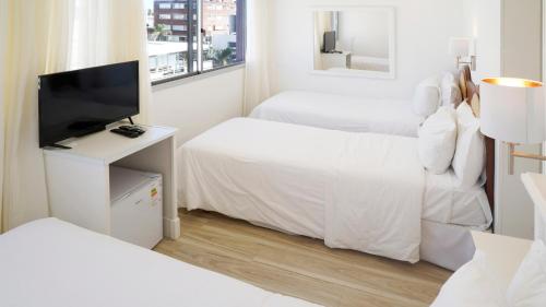 Postel nebo postele na pokoji v ubytování Hotel Romimar 3* Sup