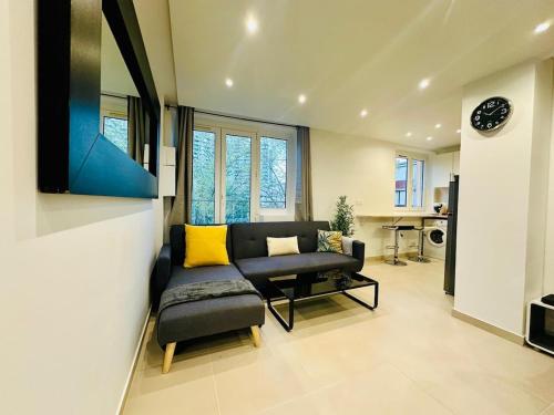 a living room with a couch and a chair at Wonderful home for 6 Personnes La Défense Arena in Nanterre