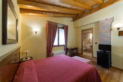 Postel nebo postele na pokoji v ubytování Agriturismo Vigneto Vecio