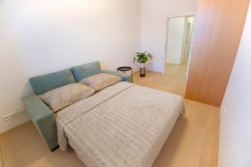 a bedroom with a bed in a room at Apartmán ARTE Spišská Nová Ves in Spišská Nová Ves