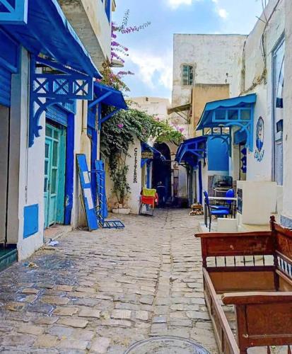 a street with blue and white buildings at Dar Maram Tunis in Tunis