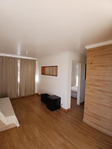 Кровать или кровати в номере Apartamento Aconchegante
