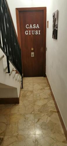 a door with a sign that reads casa guest at Casa Giusi in Sferracavallo