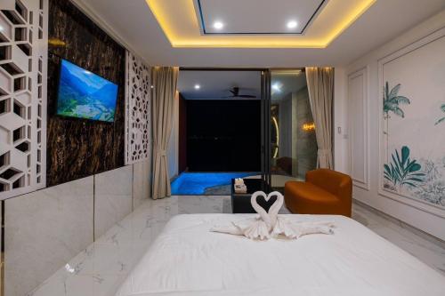 Ένα ή περισσότερα κρεβάτια σε δωμάτιο στο Madusea Grand Villa มาดูซี แกรนด์ วิลล่า