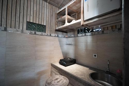a small bathroom with a sink and a sink at Uma Caming Villa Ubud in Tegalalang