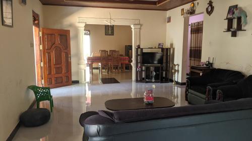 a living room with a couch and a table at Vista villa in Panama