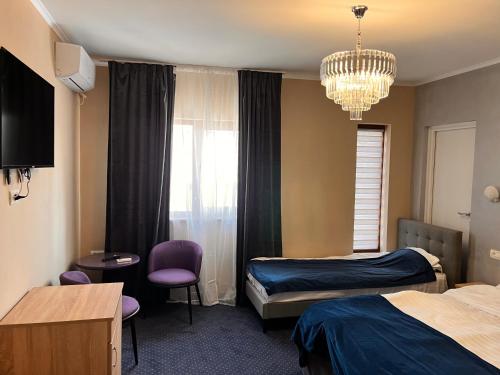 Postel nebo postele na pokoji v ubytování Live Tulcea Hotel