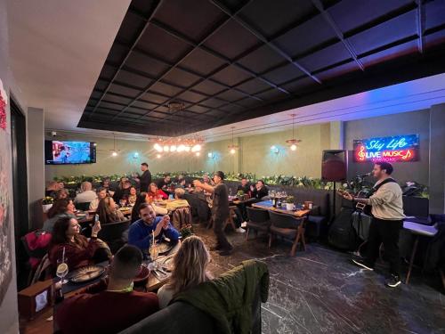 a crowd of people sitting in a room with a stage at SkyLife OldCity Hotel in Istanbul