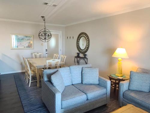 a living room with a couch and a table at Beautiful 3 Bedroom BEACHFRONT Condo (F3) - Sleeps 10 in Gulf Shores