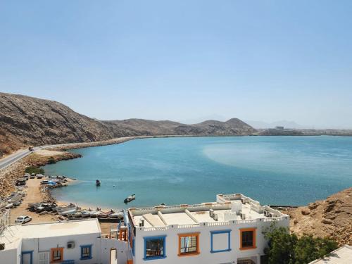 a view of a beach and a body of water at Al Ayjah Plaza Hotel in Sur