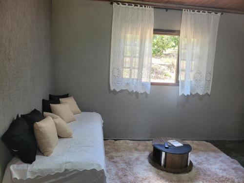 Katil atau katil-katil dalam bilik di Sua casa na roça