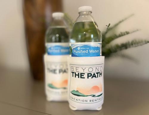 two bottles of purified water sitting on a table at Studio 604 in Bloomington