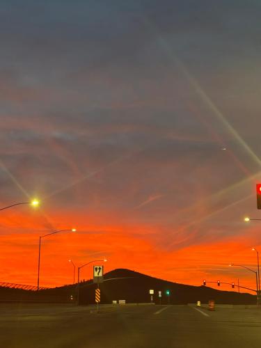 a sunset over a street with a traffic light at ULTRA COZY CASITA BY DTWN PHX in Phoenix