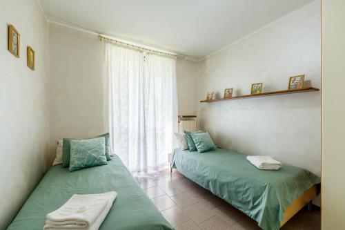 Postel nebo postele na pokoji v ubytování Casa delle Magnolie