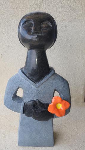 a plastic figurine of a person holding a flower at B&B Champdelaplume in Barjac