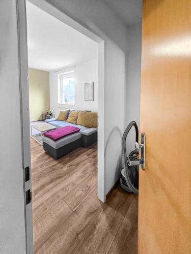 a room with a couch and a bed in it at Sparkassa Stockerau in Stockerau
